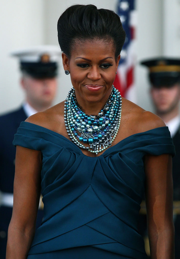 Michelle Obama loves her pearls. Here she's wearing numerous strands of blue pearls. And, she looks amazing in them!