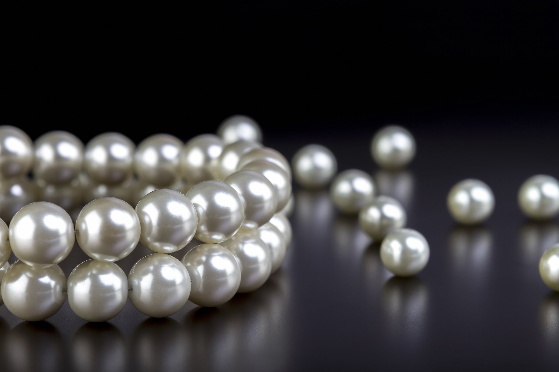 color, shape, and luster-quality of a pearl
