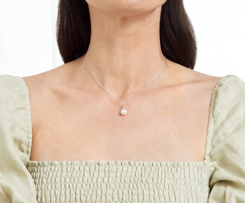 Model is wearing Hope Pendant with 8-9mm AAAA quality pearls